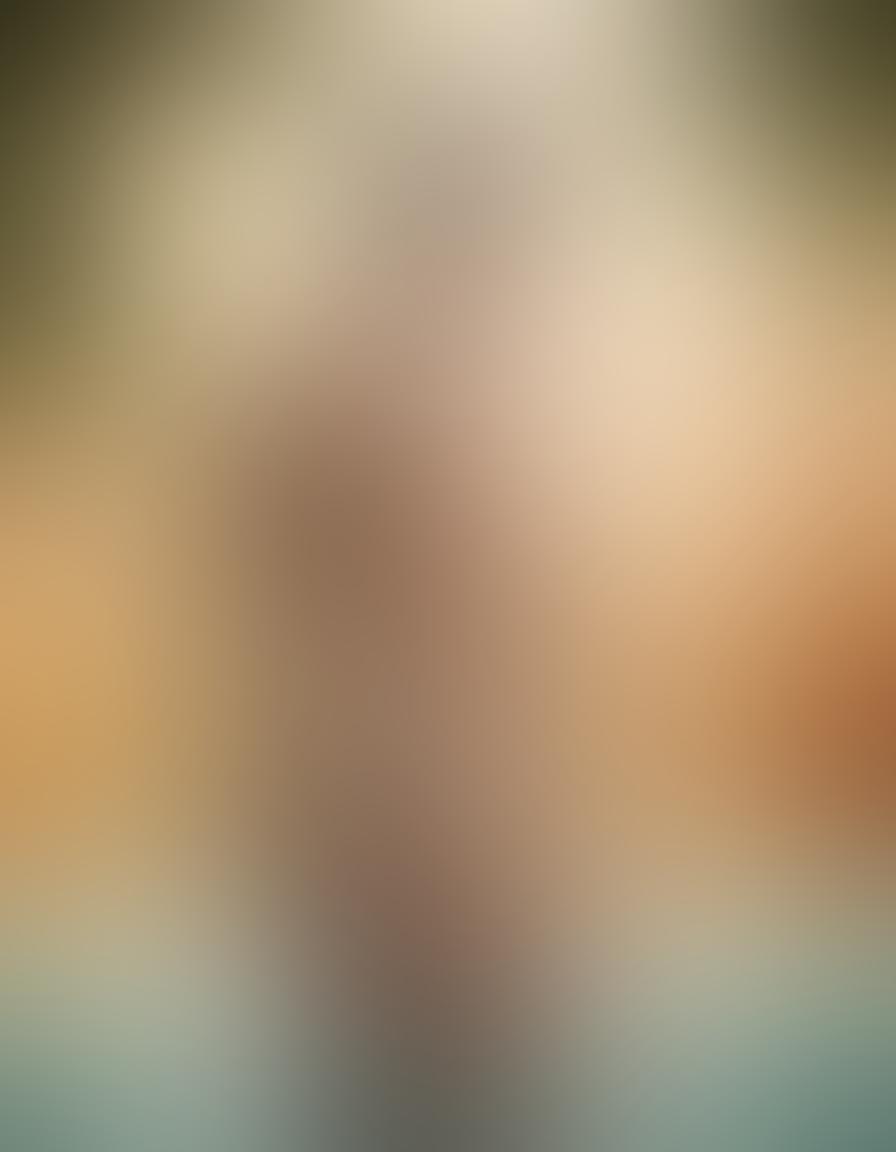 A captivating composition featuring a male figure posed artistically against a soft, gradient background, showcasing the beauty of the human form in an elegant and tasteful manner. Subtle lighting highlights the contours of the body while maintaining an air of sophistication and intimacy. Incorporate elements of nature, like flowing water or gentle foliage, to enhance the organic feel of the scene. The overall atmosphere should evoke emotion and appreciation for the art of photography. super-realistic. warm tones. soft focus.